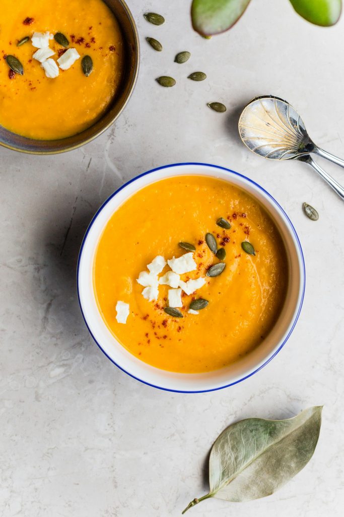 Butternut squash soup topped with feta and pumpkin seeds