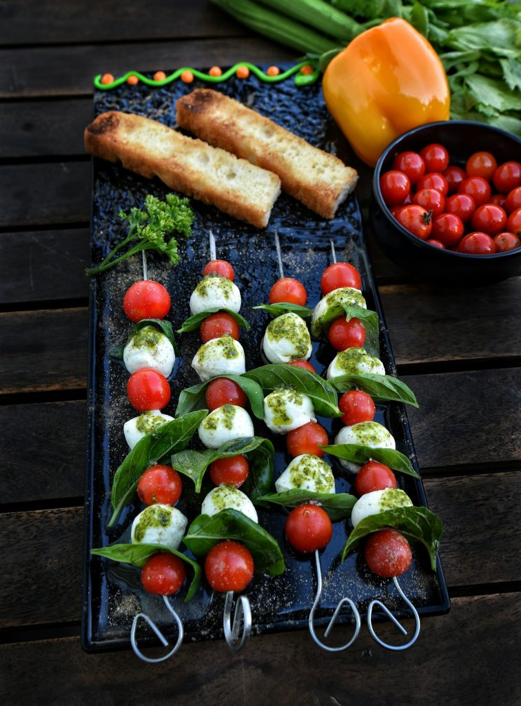 Caprese skewers with cherry tomatoes, mozzarella and basil