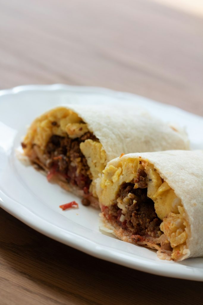 Homemade freezer breakfast burritos with eggs, sausage and cheese