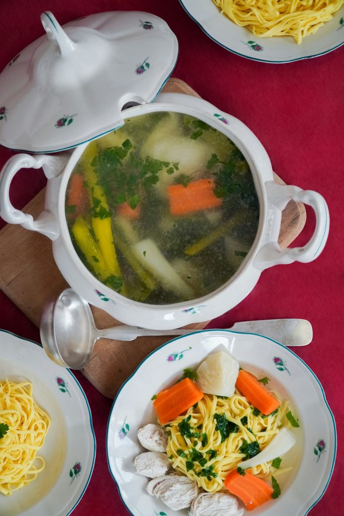 Homemade chicken noodle soup with carrots and egg noodles