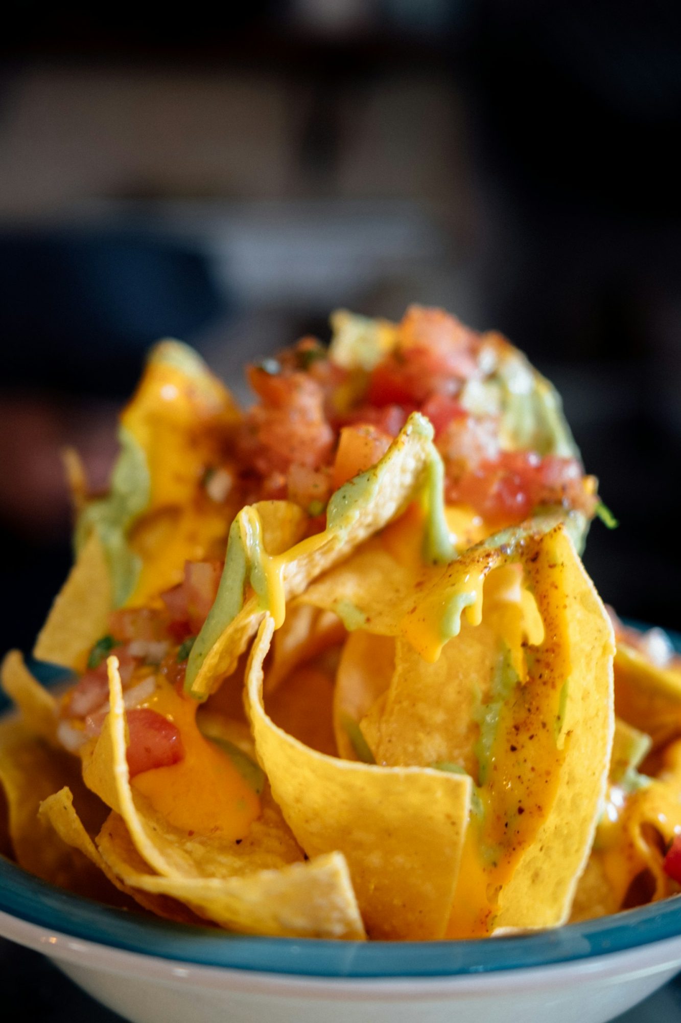 Loaded nachos with cheese sauce, pico de gallo and guacamole