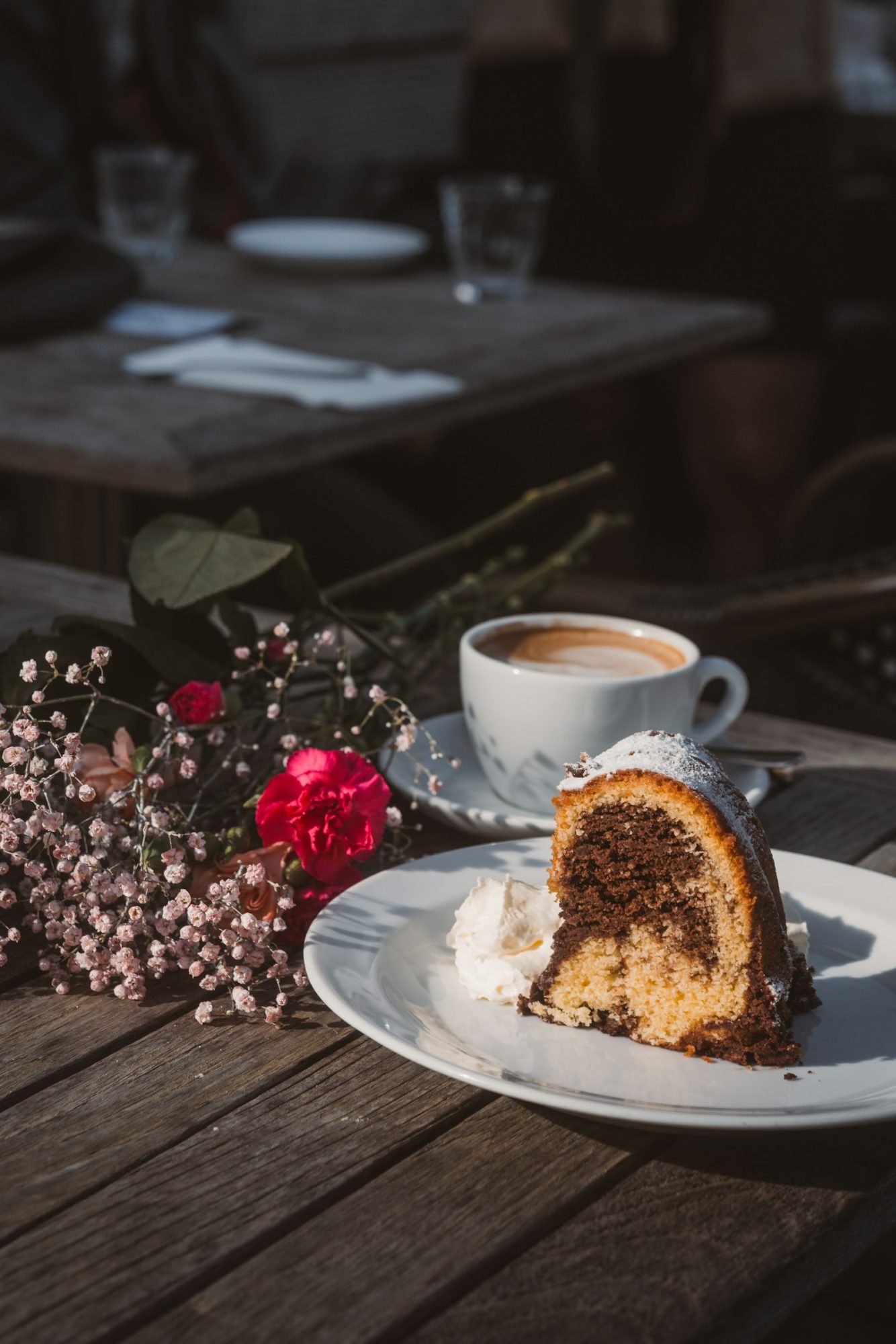 Slice of chocolate and vanilla marble cake with coffee