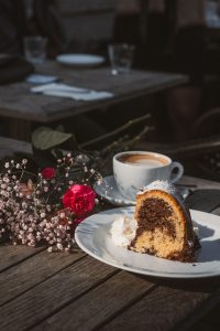 Slice of chocolate and vanilla marble cake with coffee
