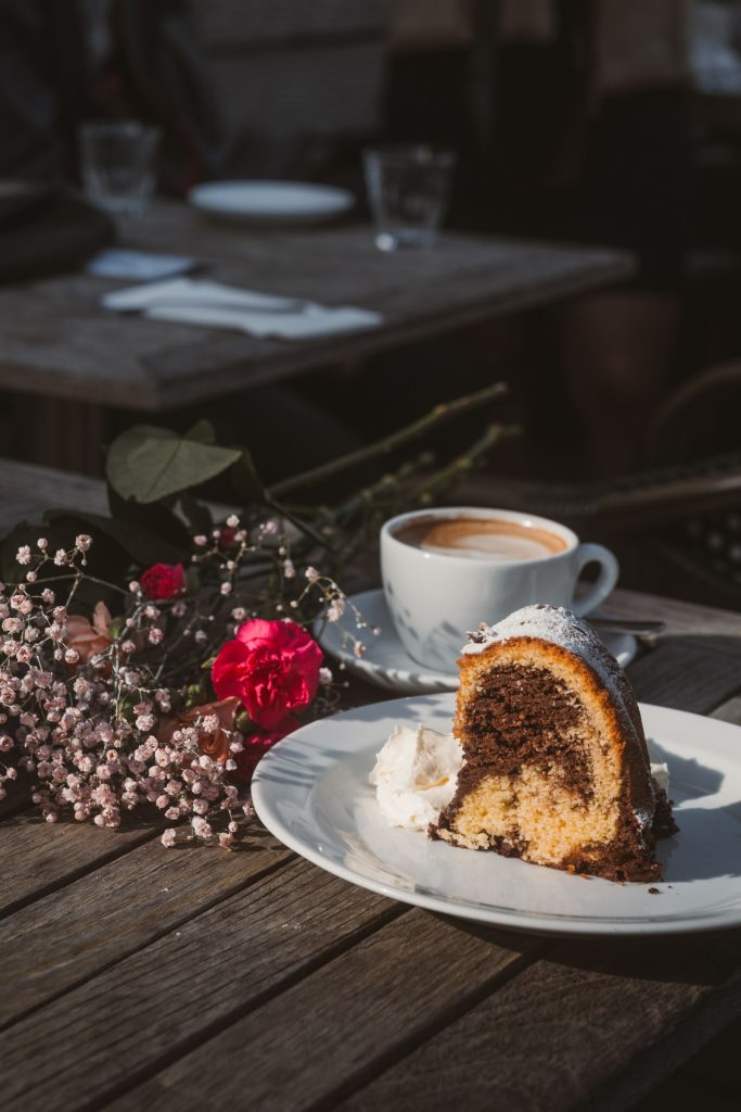 Slice of chocolate and vanilla marble cake with coffee