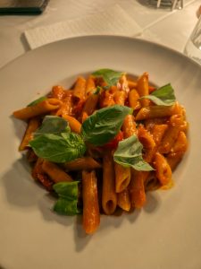 Penne arrabbiata with spicy tomato sauce and fresh basil